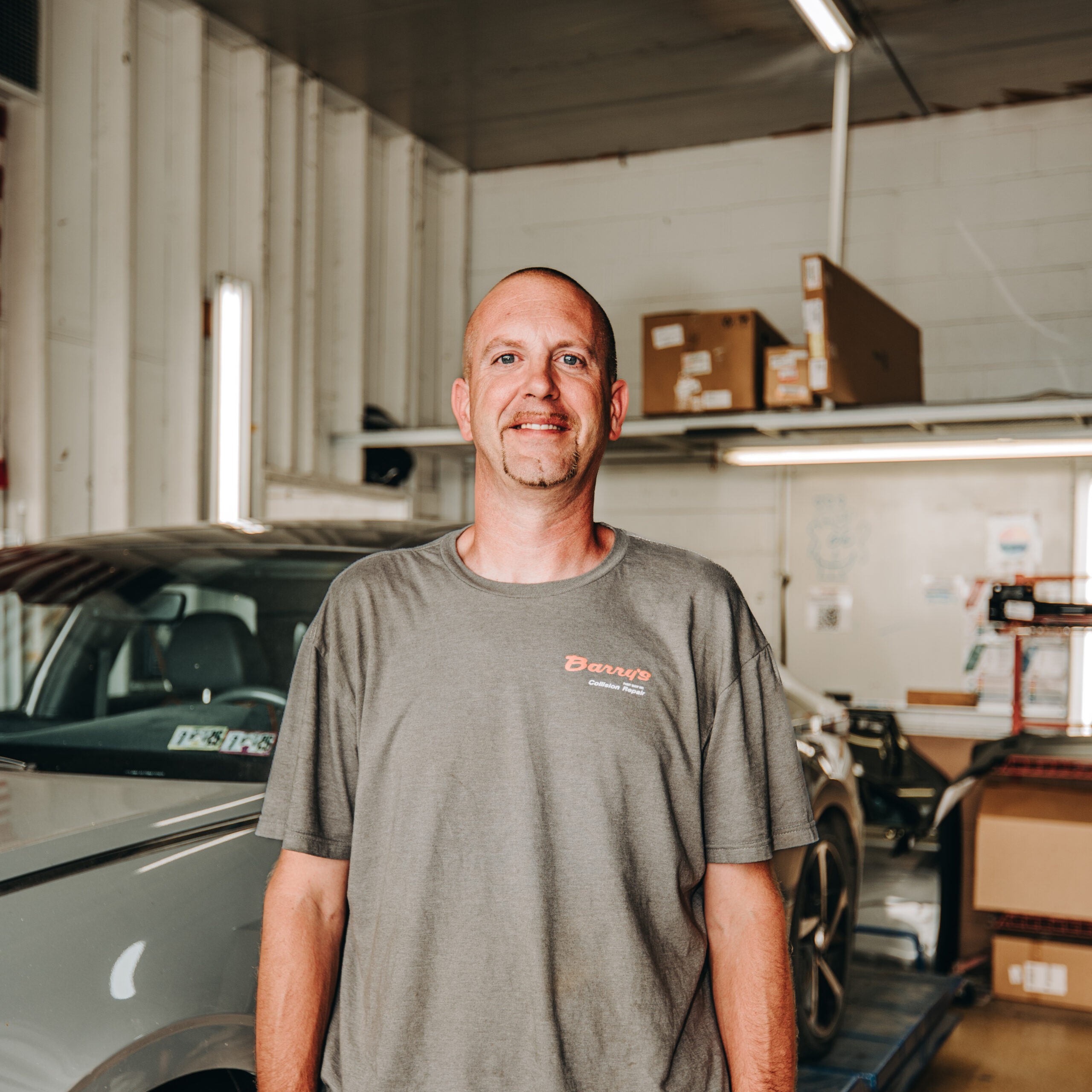 Derrick Wissler, Barry's Paint Shop assembly and damage analyzer, in auto body repair shop.