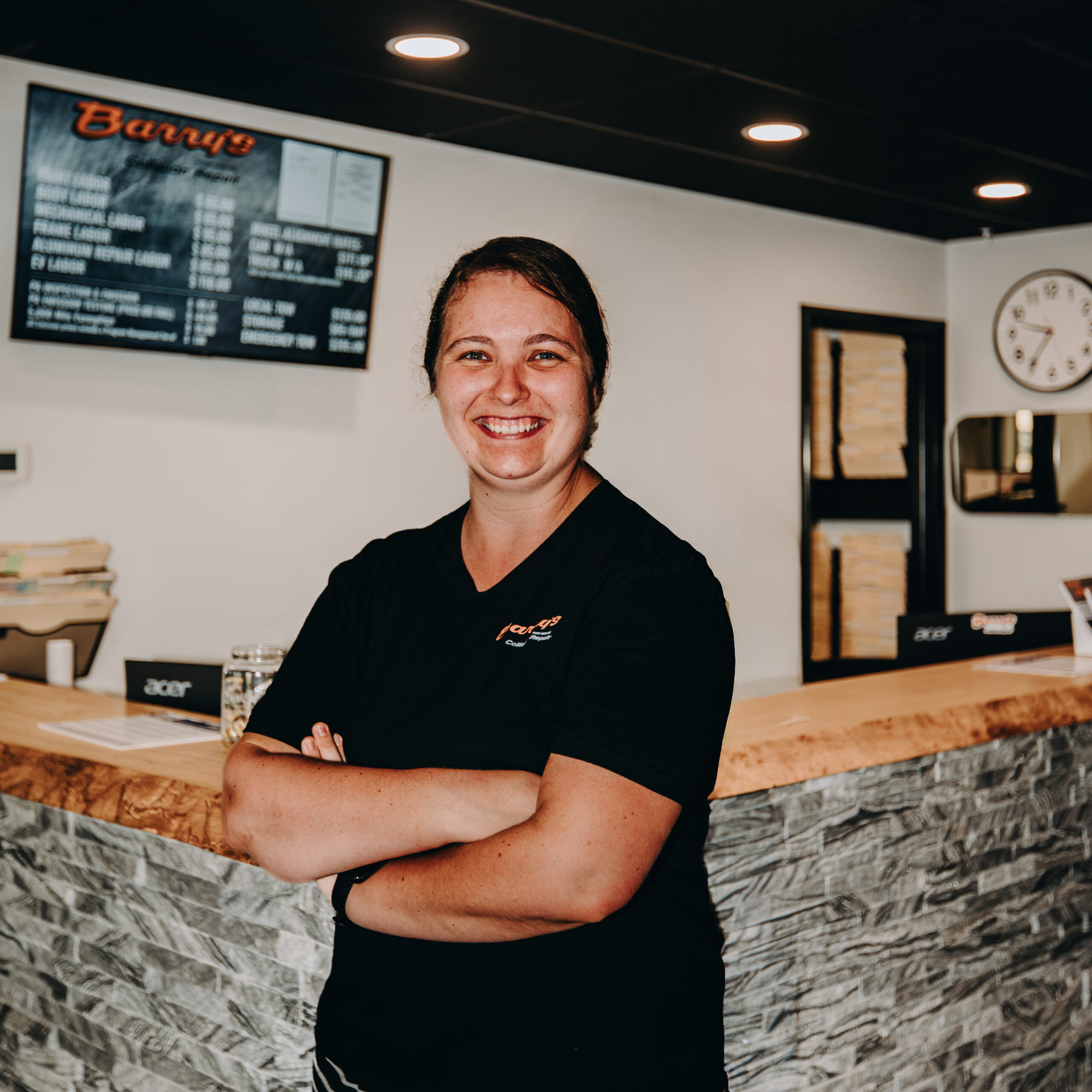 Kimberly Sensenig, Barry’s Paint Shop bookkeeper, smiling in the Ephrata, Pennsylvania office.
